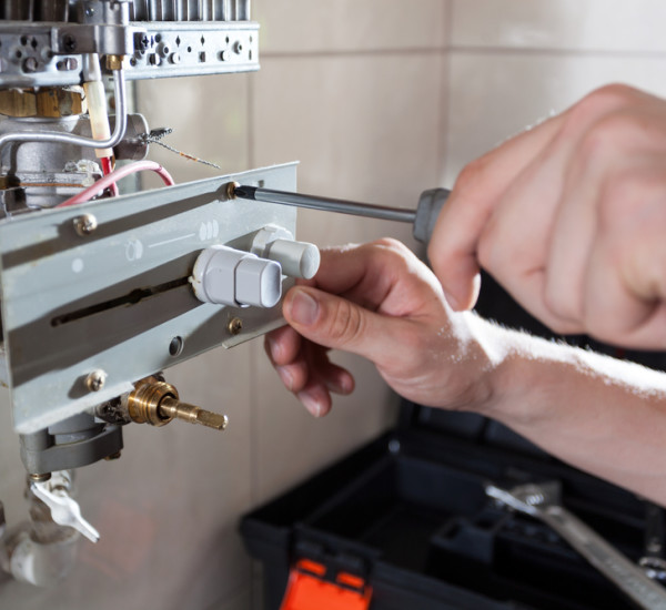An image of a qualified engineer repairing Gas Heating